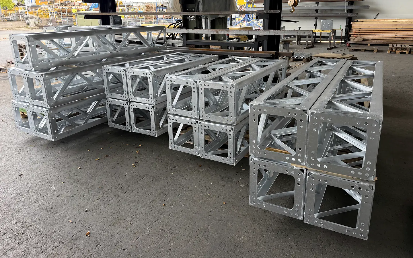Galvanised steel truss beams in different sizes at the fabrication workshop