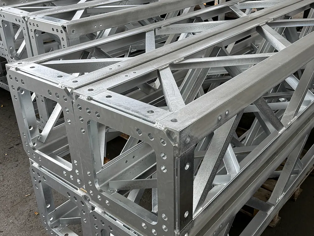 Detail of galvanised steel frames with drilled connection plates and diagonal braces