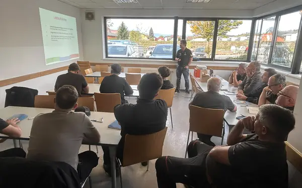 Employees attending a training session on lifting loads